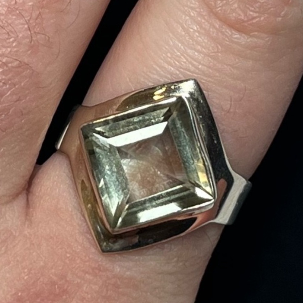 Sterling silver ring with light blue/green stone. Size 7.5